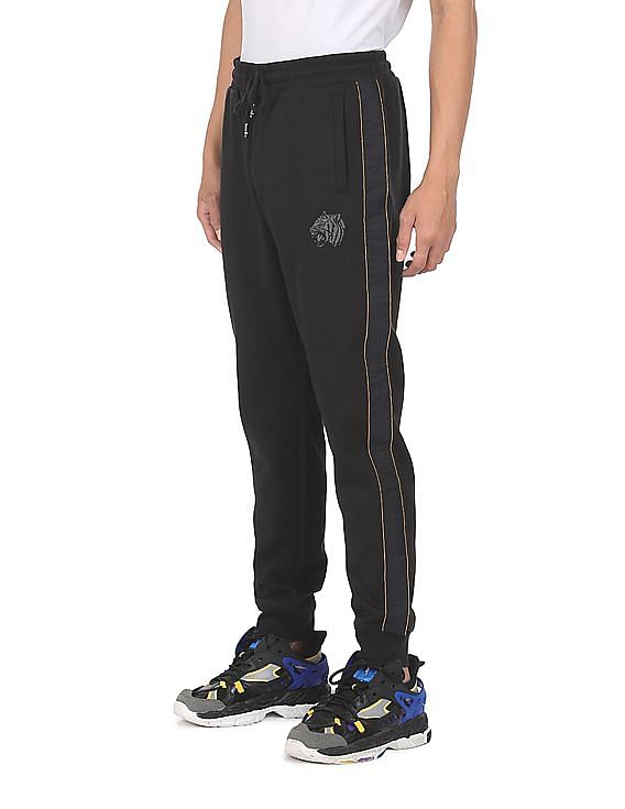 Buy Tommy Hilfiger Men Black Mid Rise Solid Sweatpants NNNOW