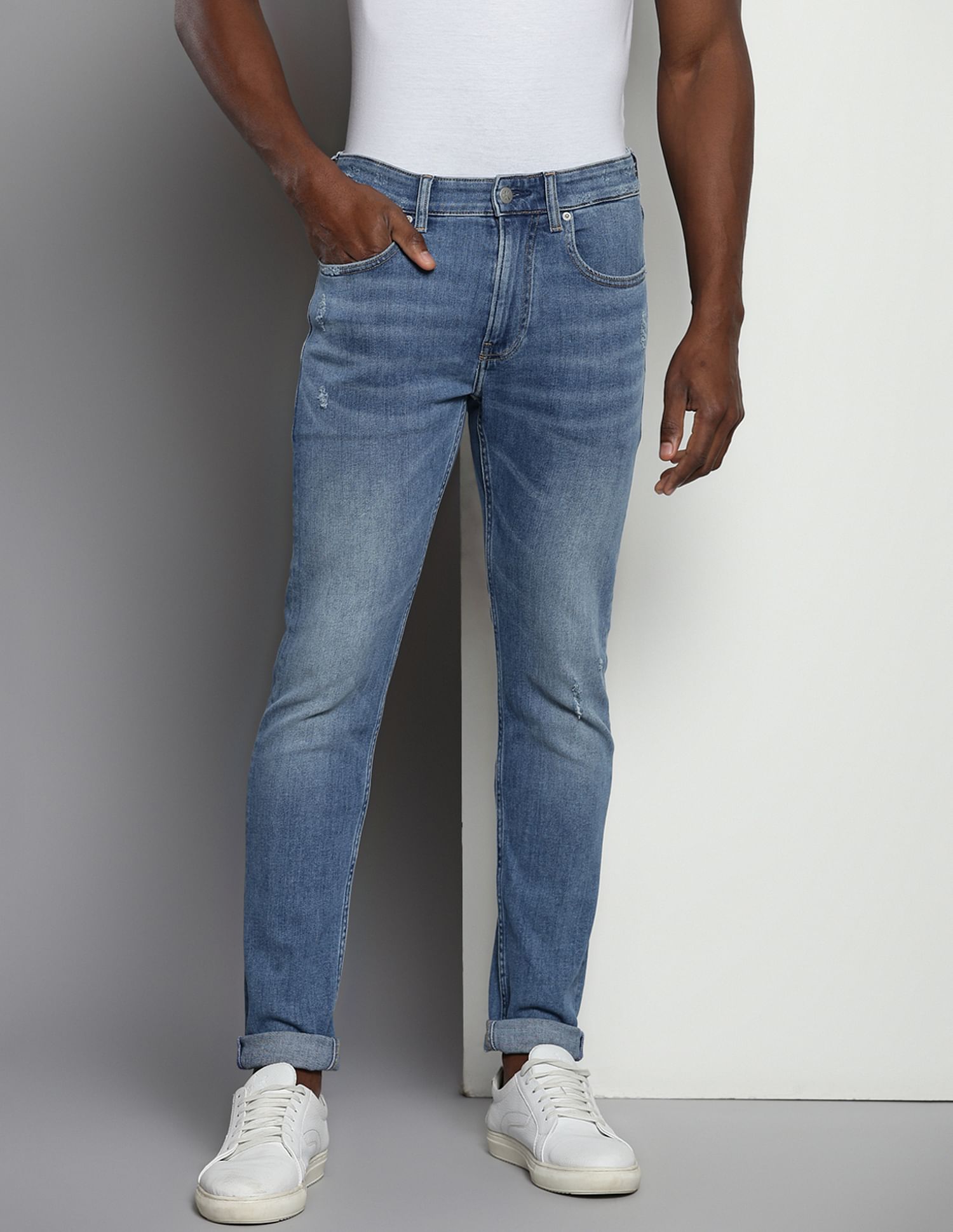 Calvin Klein Modern Tapered Fit Distressed Jeans