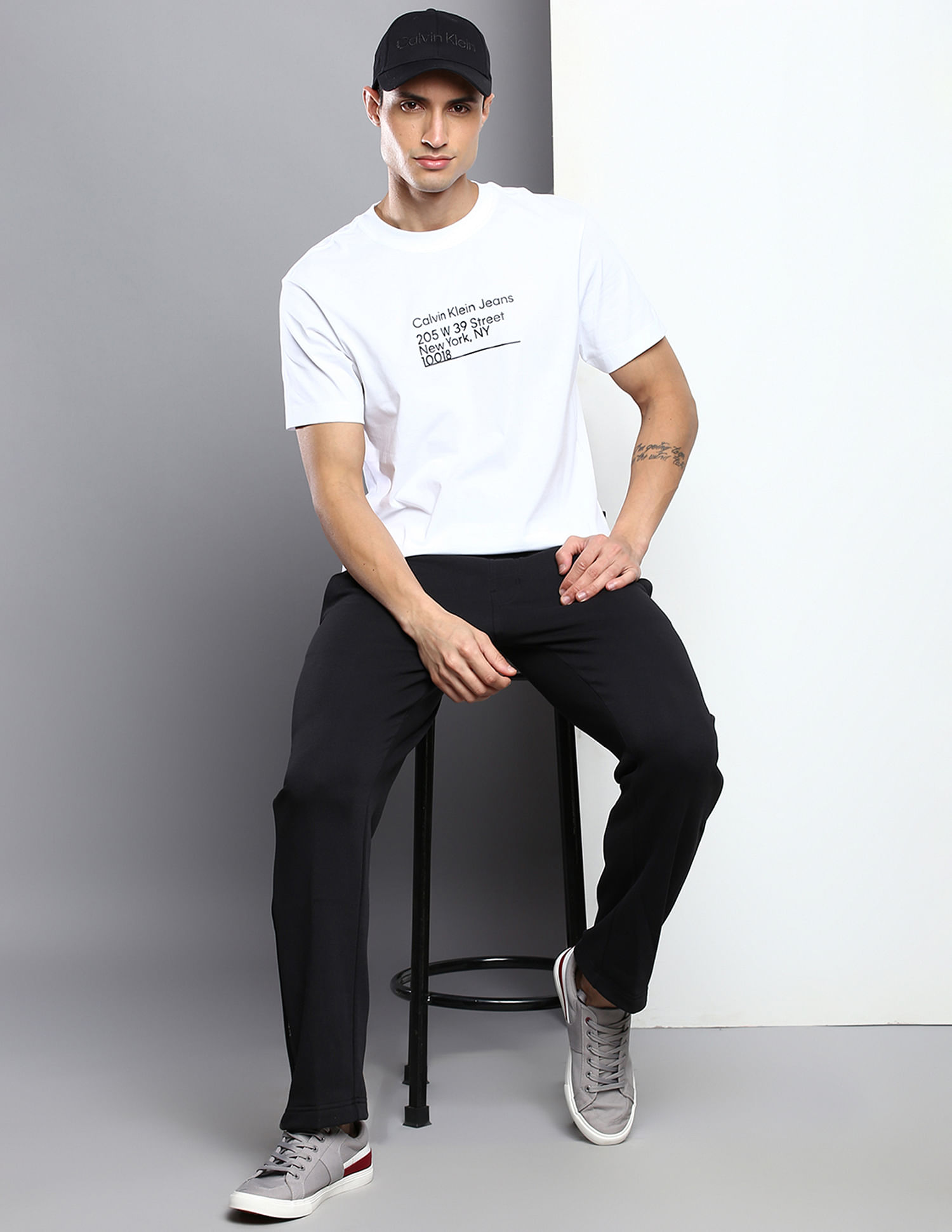 White T-Shirt And Black Trousers Minimalistic Outfit - Your Average Guy